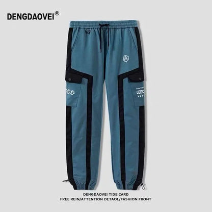 Pantalon de jogging hip-hop streetwear pour hommes, pantalon cargo décontracté pour étudiants, pantalon de rue haute taille élastique, pantalon sarouel ample au laser pour garçons