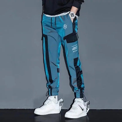 Pantalon de jogging hip-hop streetwear pour hommes, pantalon cargo décontracté pour étudiants, pantalon de rue haute taille élastique, pantalon sarouel ample au laser pour garçons